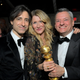 Noah Baumbach, Laura Dern, and Netflix co-CEO Ted Sarandos awkwardly try to share Dern’s Marriage Story Golden Globe in 2020.